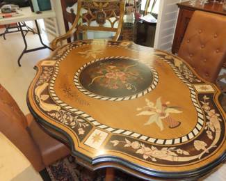 Highly decorated with marketry dining table and two matching chairs.