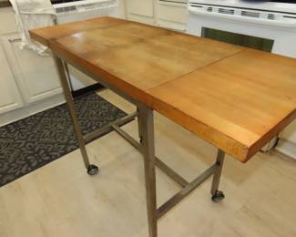 Kitchen prep table with drop leaves.