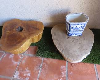 Large varnished and natural tree trunk slabs.