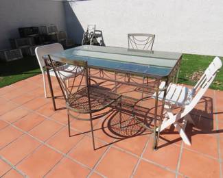 Metal and glass patio table and two chairs.