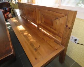 Solid wood pew like long bench.