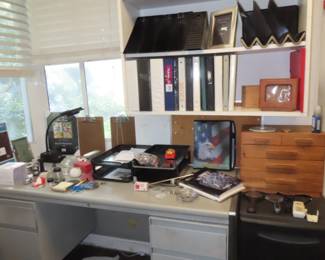 Office desk and file cabinets.