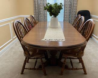 Solid oak dining table with Formica top and six chairs