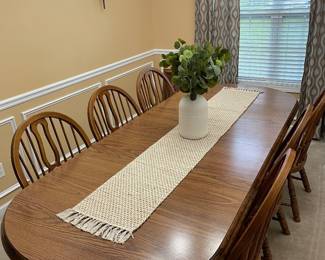 Second angle of oak table with dining chairs