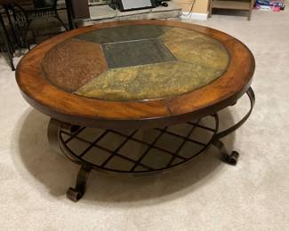 Wood, stone, and burnished metal coffee table. 
