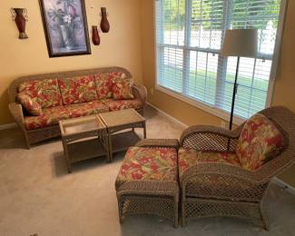 Outdoor patio furniture sofa and chair with ottoman that has been kept indoors. Not pictured: third glass top end table. 
