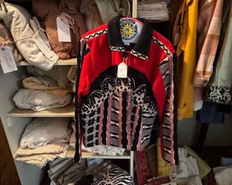 Linen closet, full of linens and fantastic coats