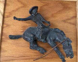 Wonderful, hanging cowboy riding a horse bronze