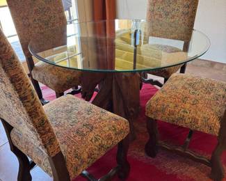 Hand carved wooden three horse head glass top table with four chairs