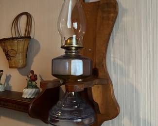 Blue oil lamp in wooden hanger 