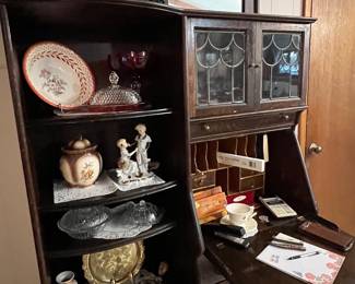 Oak secretary with leaded glass and carved lion head side view 