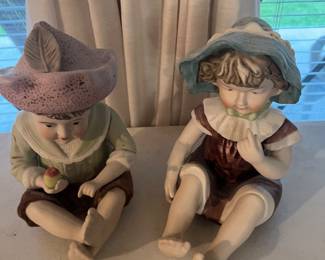 Pair porcelain piano babies 