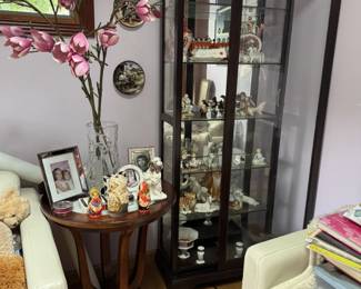 Lots of small porcelain figurines. 