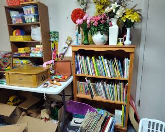 toys, books, bookcases, floral arrangements