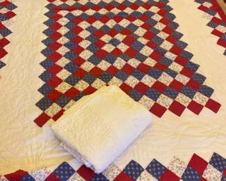 Red, White, And Blue Patchwork Quilt And A Large Blanket