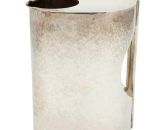259 A Mexican Art Deco-style hammered sterling silver pitcher Mid-20th century; Mexico City, Mexico Impressed to underside: STERLING 925 / CODAN / MEXICO / [Eagle 7] 8" H x 5.875" W x 3.375" D 27.4 oz. troy approximately Estimate: $1,000 - $1,500