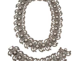 279 Margot Van Voorhies (aka Margot de Taxco, ca. 1896-1985, American) A set of Mexican silver jewelry Circa 1948-1978; Taxco, Mexico Each stamped: Margot de Taxco / Sterling / Made in Mexico / [Eagle 16] / 5348 [Design number] Comprising a 'Silver Patterned Swirls' sterling silver link necklace, with an additional small extension link, as well as a matching bracelet; the lengths variously connect to form a longer single necklace 3 pieces Necklace: 18" L x 1.625" H; Bracelet: 8.25" L x 1.625" H; Extra link: 2.75" L; All joined: 28.75" L 318.9 grams gross Estimate: $600 - $800
