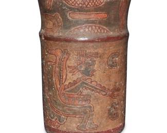 52 A Pre-Columbian-style polychrome pottery copador Circa 600-900 CE or later; Central America Painted in four colors with Mayan figural motifs 6.5" H x 4.375" Dia. Estimate: $700 - $900