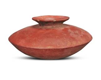 82 A Pre-Columbian Colima redware pottery olla Circa 300-600 CE or later; Mexico Of flattened form with a broad shoulder and a short, flared neck 6.25" H x 12.5" Dia. Estimate: $300 - $500