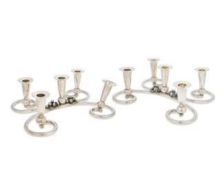 103 A pair of Peruvian sterling silver candelabra Mid-20th century Each marked: 925 / OPAISA The five-light candelabra each with two C-scroll arms and grape bunches at center 2 pieces Each: 5.375" H x 14.125" W x 11.5" D Total weight: 69.7 gross oz. troy approximately Estimate: $3,000 - $5,000