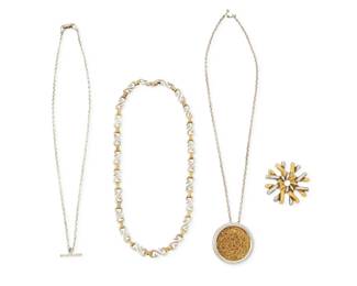 266 A group of Tane sterling silver and vermeil jewelry Late 20th century Five stamped: Tane; further variously stamped: MEX / 925 / ME 33 / ME 32 Comprising a sterling silver and vermeil starburst knotwork motif brooch of interlocking silver and gold tone 'laces' (1.75" Dia.), a sterling silver and vermeil chain link choker necklace with 'S' form links (17" L), as well as a modernist style round pendant brooch with tangled interlaced vermeil wire center, on a Tane sterling chain (19.5" L x 1.5" Dia.), and an associated silver 'T' bar charm on a Tane sterling chain (20" L) 6 pieces 127.4 grams gross Estimate: $400 - $600
