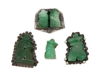 284 Four Mexican silver and hardstone brooches Mid-20th century Two variously marked for sterling and for Mexico; one further marked MR [conjoined] A group of four silver brooches with carved green hardstone sleeping figures, three with decorative wire overlay edging 4 pieces Largest: 2.625" H x 2" W; Smallest: 1.5" H x 0.875" W 116.5 grams gross Estimate: $200 - $400