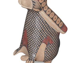 54 Nicolás Ortiz Jr. (b. 1992, Mata Ortiz) A polychrome pottery rabbit effigy vase, early 21st century Incised to underside: Nicolás Ortiz With red and black checkered and geometric motifs on a marble cream slip ground 12" H x 6.5" W x 6.5" D Estimate: $200 - $400