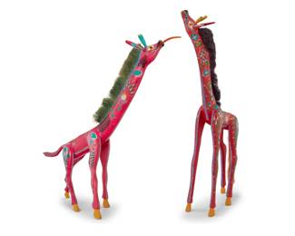 236 Two Mexican polychrome wood giraffe alebrijes Late 20th century; Oaxaca, Mexico One signed and inscribed: HECHO POR / JACOBO ANGELES OJEDA / SN. Martin Tilcajete / OCOTLAN OAXACA / 1998 / Mexico / INDIGENAS ZAPOTECOS; the other signed: JACOBO ANGELES Y ESPOSA Comprising two vibrantly painted folk art spirit figures, each with fibrous mane, one with fibrous tail 2 pieces Taller: 31.5" H x 17" W x 5.25" D; Shorter: 28" H x 26" W x 11.5" D, each approx. Estimate: $200 - $400