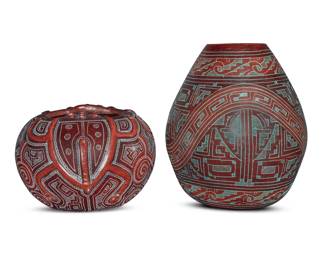 145 Two Brazilian Marajoara-style sgraffito pottery jars Late 20th century Each with incised signature: MARIVALDO; one dated: 96 Each incised with geometric designs, comprising one sculpted with two frogs in relief, the taller with green in-filling to incised motifs 2 pieces Taller: 10.375" H x 8.875" Dia.; Frog: 6.25" H x 8.625" Dia. Estimate: $200 - $300