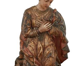 13 A Spanish Colonial polychrome carved wood santo bulto 19th century With gilt and painted designs in the robe, surmounted by a gold-toned bronze crown and adorned with metal earrings 22.5" H x 16" W x 9.5" D Estimate: $800 - $1,000