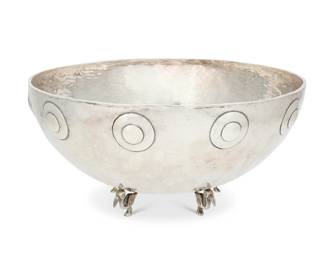 102 Graziella Laffi (1923-2009, Peruvian) A sterling silver footed bowl, mid/late 20th century Marked: Peru / G. Laffi / 925 The hammered silver serving bowl with an applied disk motif band to the rim and raised on six bird-form feet 62.4 oz. troy approximately 6.125" H x 13.375" Dia. Estimate: $3,000 - $5,000