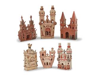 19 Six Mexican pottery churches 20th century Each unmarked Comprising two redware and four with red accents on white slip ground 6 pieces Tallest: 16.5" H x 8.5" W x 7.25" D; Shortest: 8.25" H x 6.25" W x 3.375" D Estimate: $500 - $700