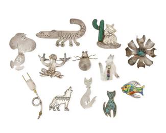 292 Twelve Mexican-style silver pictorial brooches Mid/late-20th century Eleven variously marked for sterling; nine marked for Mexico; eight variously marked for maker: JF [Jeronimo Fuentes] / EFS / HH / SU / JE / TC-105 / TG-24 / TR-142 Comprising twelve figural brooches in various sizes and motifs, most in sterling silver, including a sterling silver Snoopy articulated pendant/brooch, a seated figure beside a carved set green stone cactus, a multicolored enamel angelfish pin, two coyote brooches including one with set gemstones, two cat pins including one with chipped stone inlay, and various other motifs including a sculptural frog, a stylized alligator/airplane, an insect, an electrical plug, and a modernist-style sculptural flower brooch with central green stone Largest: 2.25" H x 3.875" W; Smallest: 1.25" H x 1.625" W 173.6 grams gross Estimate: $200 - $400