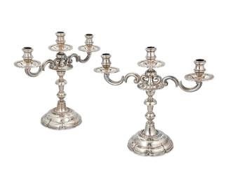 72 A pair of Sanborns Spanish Colonial-style sterling silver candelabra Mid-20th century; Mexico City, Mexico Each marked to underside: 3 [Three owls] / Sanborns Mexico / Sterling With lobed standards issuing three lights with scrolled arms 2 pieces Total weight: 109.9 gross oz. troy approximately Each: 12.75" H x 14.25" W x 5.625" D Estimate: $2,000 - $3,000