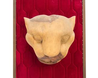 215 A Latin American carved wood jaguar head 20th century Unmarked Mounted to a framed velvet backing Head: 11.5" H x 11.5" W x 8.375" D; Framed: 24.25" H x 16.25" W x 8.25" D Estimate: $200 - $400