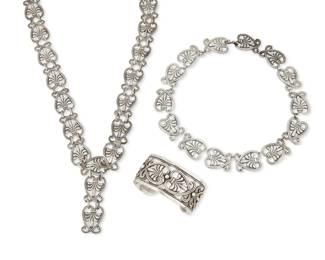 278 Margot Van Voorhies (aka Margot de Taxco, ca. 1896-1985, American) A suite of Mexican silver jewelry Circa 1948-1978; Taxco, Mexico Each stamped: Margot de Taxco / Sterling / Made in Mexico / [Eagle 16] / [Design number] Three works in sterling silver comprising a long link necklace or belt with scrolled heart motif links (No. 5241; 27" L x 0.875" H) together with a matching collar link necklace (No. 5107; 16.5" L x 0.875" H) and a cuff bracelet (No. 5308; 6.875" total inner C x 1.25" H, gap: 0.875") 3 pieces 278.7 grams Estimate: $600 - $800