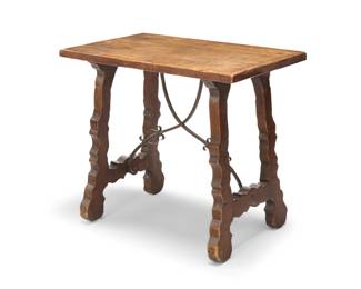 51 A Spanish Revival fratino library table Early/mid-20th century Supported on shaped legs and feet joined by a wrought-iron curvilinear X-form stretcher 28" H x 32" W x 20" D Estimate: $300 - $500