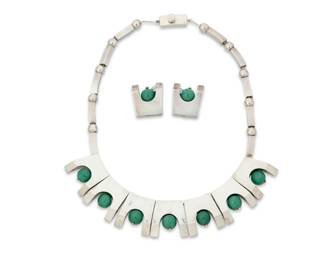 271 Antonio Pineda (1919-2009, Mexican) A set of Mexican silver and aventurine jewelry Circa 1953-1980; Taxco, Mexico Clasp stamped with crown mark for Antonio Pineda; further stamped: Taxco / Mexico / CM / 970 [all in a triangle] / [Eagle 121] Comprising a sterling silver modernist style necklace with geometric links suspending aventurine beads, suspended from a chunky bar and bead chain, and with a pair of matching ear clips 3 pieces Necklace: 16.5" L x 1" H; earrings: 1" H 141.5 grams gross Estimate: $1,500 - $2,000