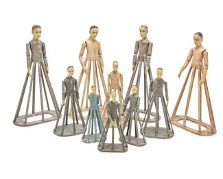 29 A group of ten Spanish Colonial-style cage doll santos 20th century Each painted carved wood, with inset glass eyes and articulated arms, most with pegs in the crown of the head 10 pieces Tallest: 39" H x 20.5" W x 11.25" D; Shortest: 20.75" H x 9.25" W x 6" D Estimate: $3,000 - $5,000