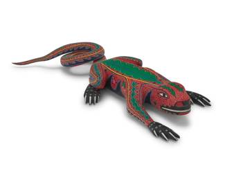234 Gerardo Ramírez Morales (b. 1953, Mexican) A polychrome carved cedar iguana alebrije, late 20th century; Oaxaca, Mexico Signed and inscribed: Gerardo Ramírez M / Arte Mexicano / Oaxaca _ Mexico 2.5" H x 21.25" W x 9.75" D Estimate: $200 - $400