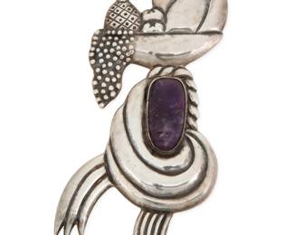 285 A Mexican silver and amethyst figurative brooch Mid-20th century Stamped: Sterling / Lico / Mexico A sterling silver figural brooch featuring a masked bust in carved amethyst, with repoussé fruit basket and scarf headdress details 4.75" H x 2.5" W 45.2 grams gross Estimate: $200 - $400