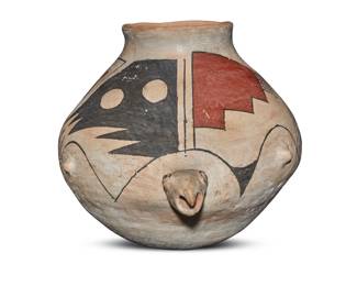 74 A Mata Ortiz polychrome pottery turtle effigy jar Mid/late 20th century Incised to underside: R Quezada With turtle head, arms, and tail sculpted in relief, decorated with red and black stepped and geometric motifs on a cream slip ground 7.5" H x 10.75" W x 8.25" D Estimate: $200 - $400