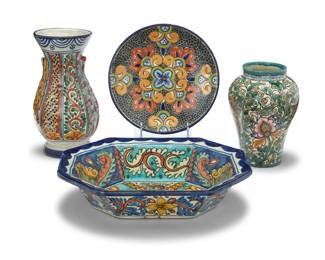 182 Four Mexican Talavera polychrome pottery vessels Mid/late 20th century Two marked in underglaze: Puebla, Mex; one marked indistinctly for Guanajuato maker Each decorated with floral motifs, comprising: Serving dish (3.125" H x 12.875" W x 10.25" D) Round plate (1.125" H x 8.875" Dia.) Taller vase (10" H x 5.125" Dia.) Shorter vase (7.75" H x 5.25" Dia.) 4 pieces Estimate: $300 - $500