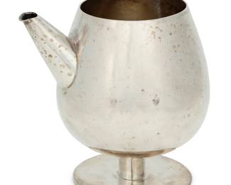 260 A William Spratling sterling silver pitcher William Spratling (1900-1967) Circa 1962-1964, Third Design Period; Taxco, Mexico With factory marks; further marked: [Eagle with indecipherable number] 5.375" H x 5.625" W x 4.5" D 12.4 oz. troy approximately Estimate: $400 - $600