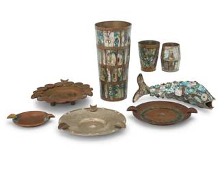 166 A group of Mexican bar articles Early/mid-20th century Tumbler impressed: MADE IN MEXICO / [indecipherable] TAXCO; one shot glass impressed: ALPACA Comprising a tumbler, two shot glasses, and an articulated fish-form bottle opener, each with inlay or overlay of mother of pearl, along with four mixed metal ashtrays, two with inlaid hardstone, one with applied Mexican coins 8 pieces Tumbler: 6" H x 2.875" Dia.; Largest ashtray: 1.25" H x 5" W x 4.75" D Estimate: $200 - $400