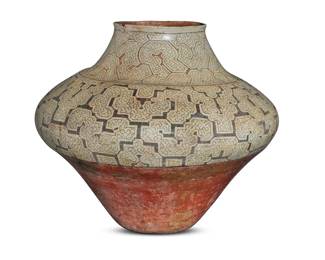 53 A monumental Shipibo Conibo masato vessel 20th century; Peru With black on white serpentine geometric designs above a terracotta wash, used for fermenting cassava beer 20" H x 22.75" Dia. Estimate: $700 - $900