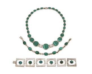 264 Three Mexican sterling silver and green stone jewelry items Late 20th century Each variously stamped for maker, Mexico, and for Sterling: 925 / TE-13 / TM-153 / 950 Comprising a sterling silver collar link necklace with graduated set malachite links (17" L x 0.75" H) a narrow chain link bracelet with set malachite oval links (8.25" L), and a chunky modernist style openwork square link bracelet with set green stone cabochons, likely azurmalachite (7.25" L x 1" H) 3 pieces 166.3 grams gross Estimate: $400 - $600