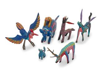 242 Six Mexican polychrome wood alebrijes Late 20th/early 21st century; Oaxaca, Mexico Coyote signed and inscribed: Porfirio Sosa Gutierrez; winged horse: ROBERTA ANGELES; armadillo group signed and inscribed: Pedro Ramirez / Arrazola Xoxo / Oaxaca; rooster: Agustin Vasquez Aguilar / SN. Martin / Tilcajete. / Oaxaca; antlered incised: Inocencio Melchor; pink on black: Cornelio Ortega / OAXACA Comprising various vibrantly painted folk art spirit figures 6 pieces Armadillo group: 6.5" H x 12" W x 2.5" D; Smallest: 3.125" H x 2.375" W x 1.25" D Estimate: $200 - $400