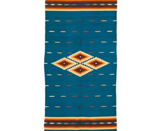 44 A Mexican sarape Circa 1920s Finely woven in blue, tan, brown and orange wool with four central floating diamonds, multiple banded motifs, striped ombré banding and elaborate knotted fringing to each end 80" H x 37.75" W approximately Estimate: $700 - $900