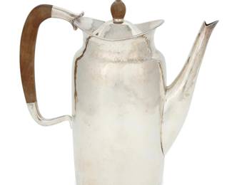 258 A Mexican hammered sterling silver teapot Mid-20th century; Mexico City, Mexico Impressed to underside: STERLING 925 / CODAN / MEXICO / [Eagle 7] With wood handle and lid finial 8.75" H x 8.75" W x 3.625" D 25.2 gross oz. troy approximately Estimate: $1,000 - $1,500
